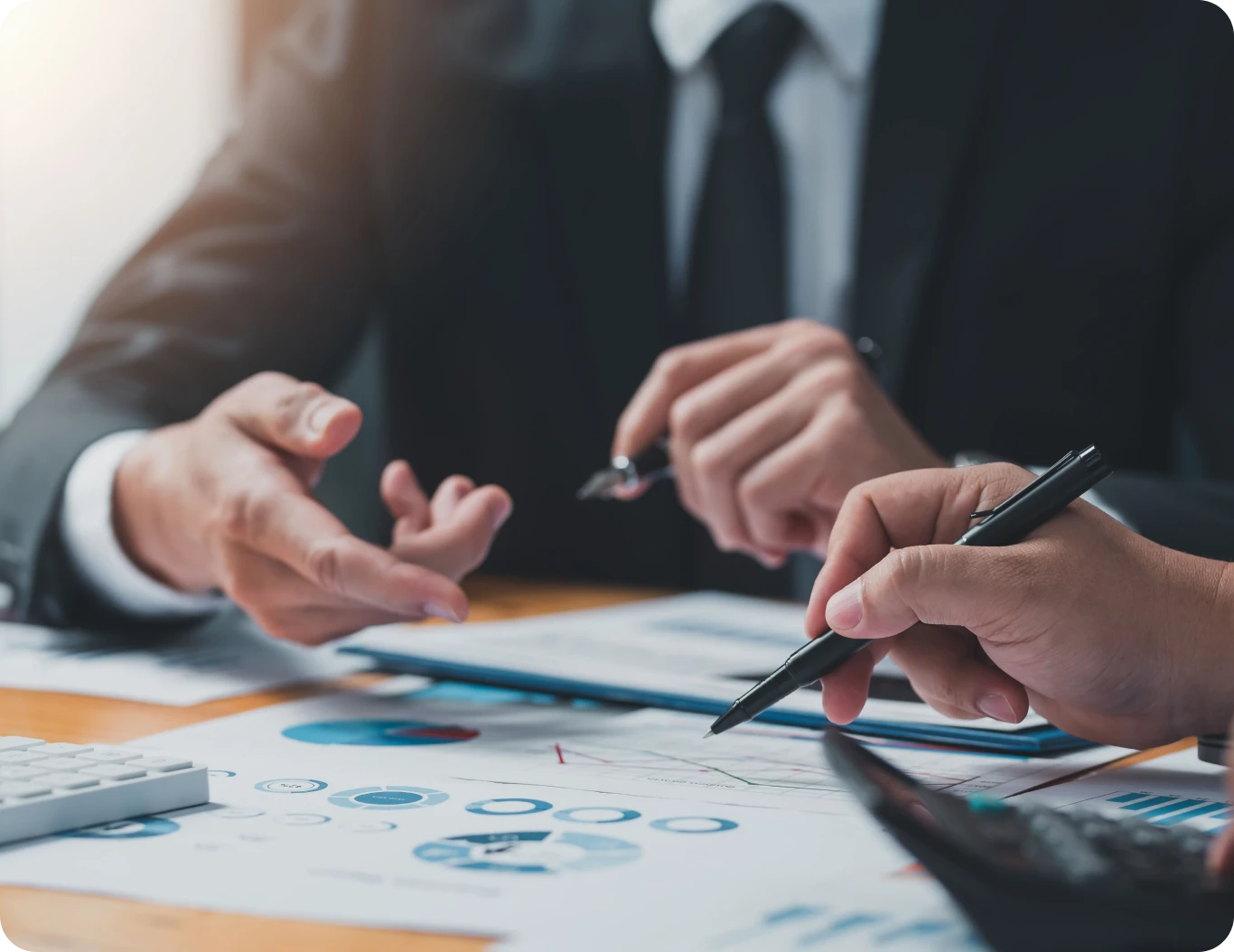 Hands analyzing business reports